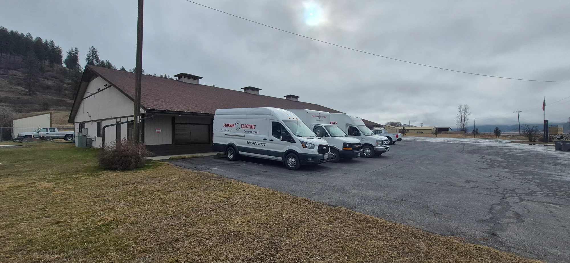 Floener Electric service vans parked outside a building in Northeast Washington